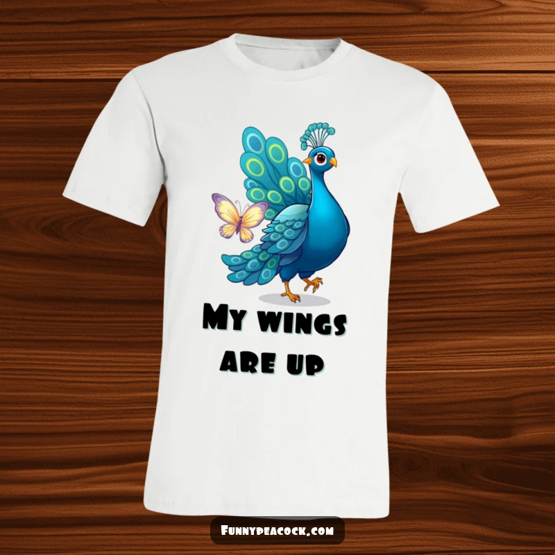 Funny peacock t-shirt, depicted mid-chase, playfully trying to catch a butterfly with its tail, a humorous and active design.
